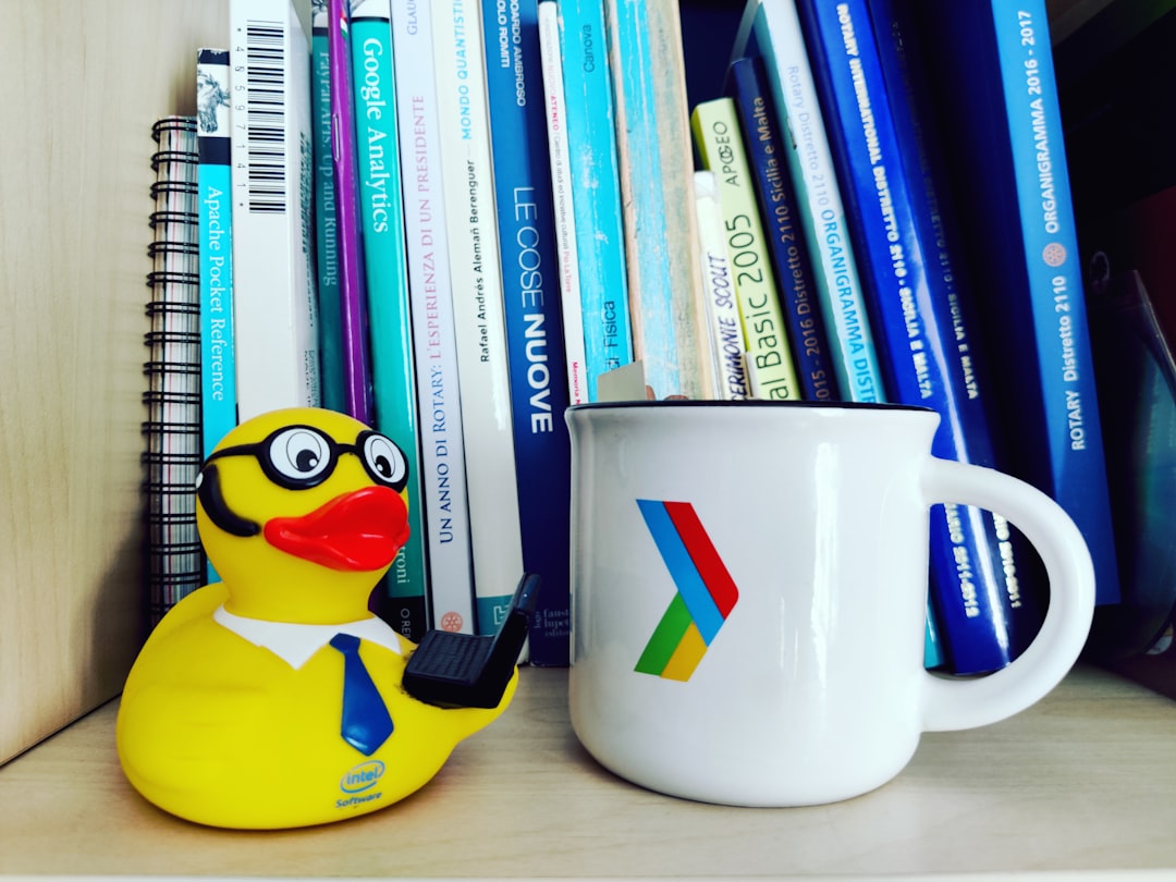 a-mug-next-to-a-stack-of-books-v20ua-0cfgg